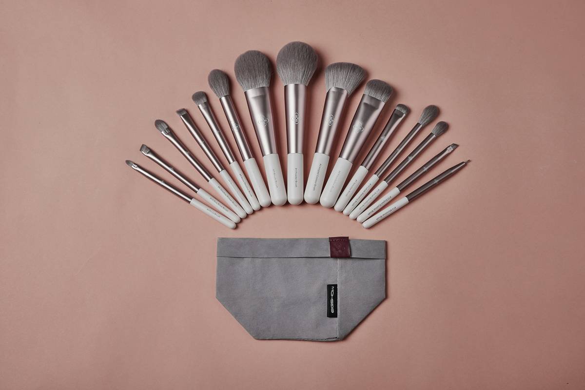 Side-by-side comparison chart showing finish results from puff, dome brush, and flat-top brush applying the same translucent powder