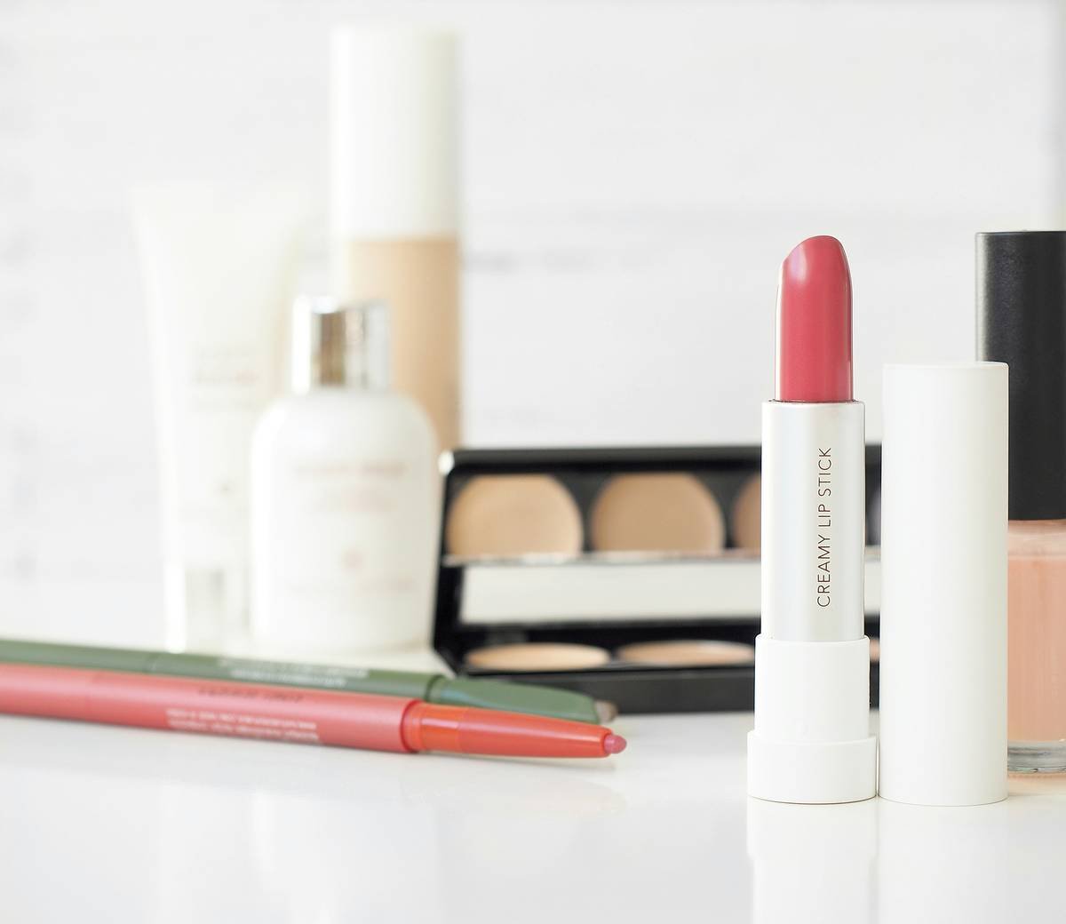 Professional makeup foundation tool comparison showing brush vs sponge application results